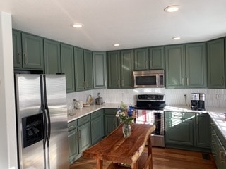 after - kitchen cabinets repainted green