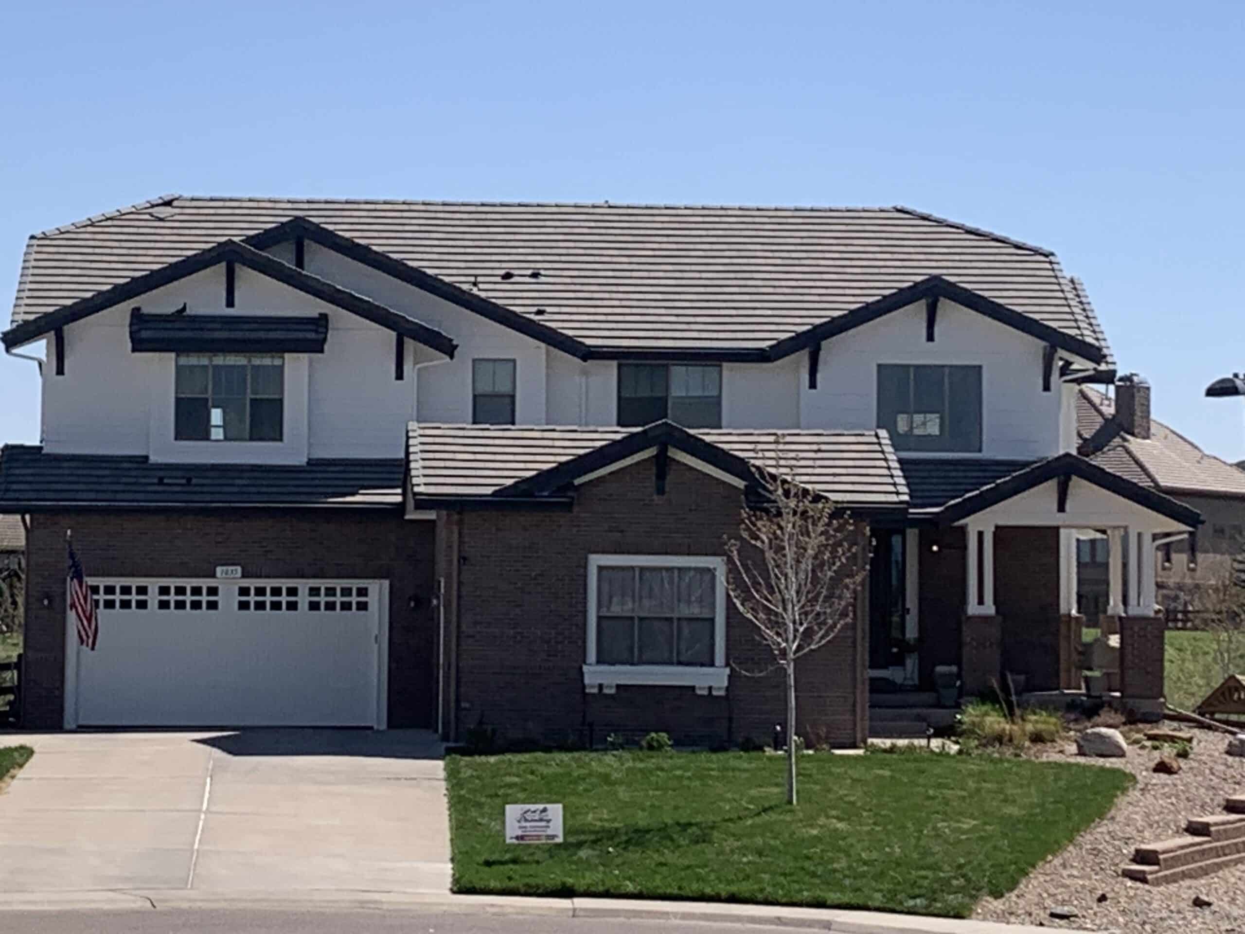 Black And White Two-Story Home Best Paint for Gutters, Fascia, and Soffit