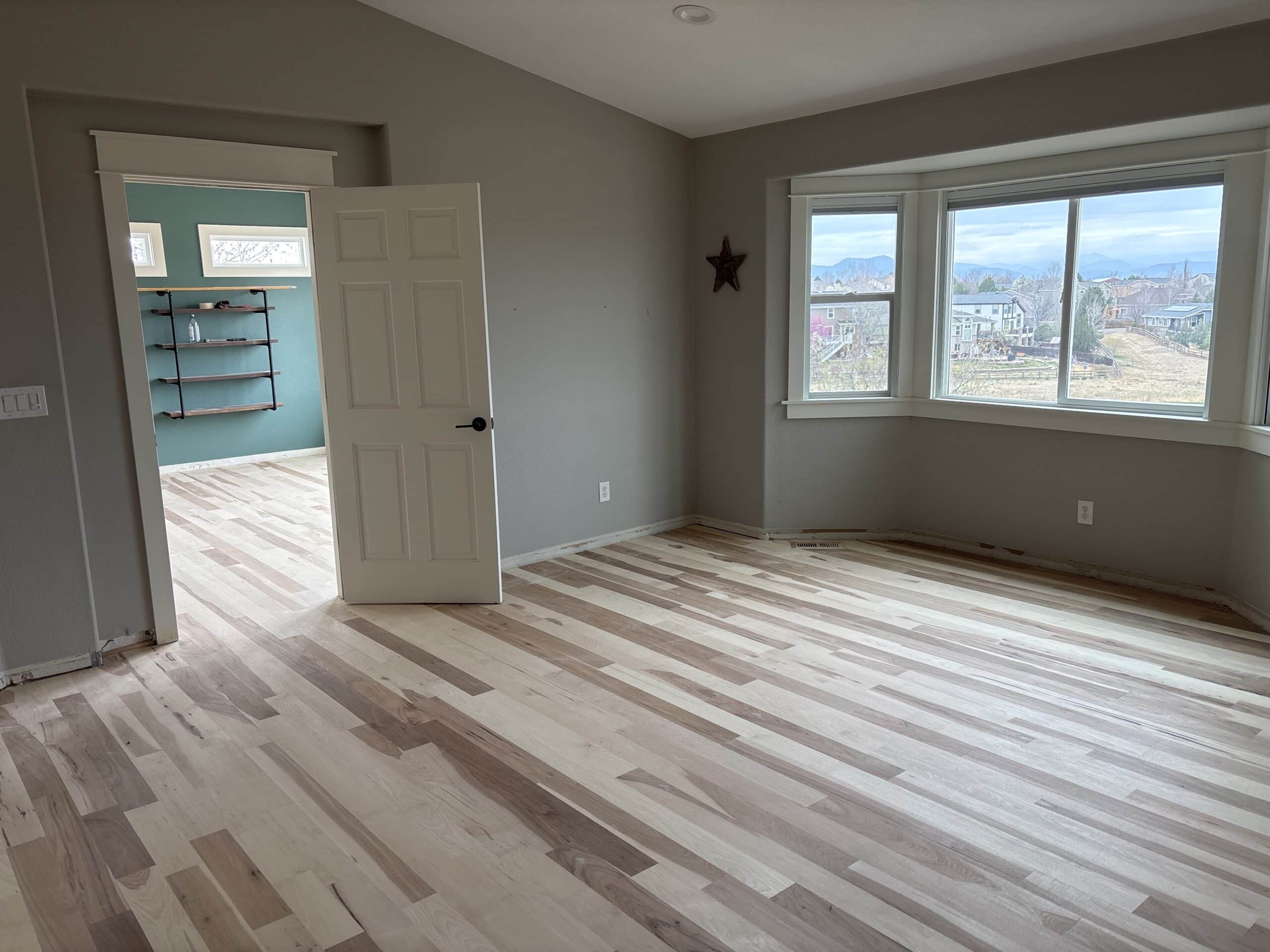 Gray Painted Residential Bedroom Finished bright interior with white painted cabinetry and surrounding surfaces
